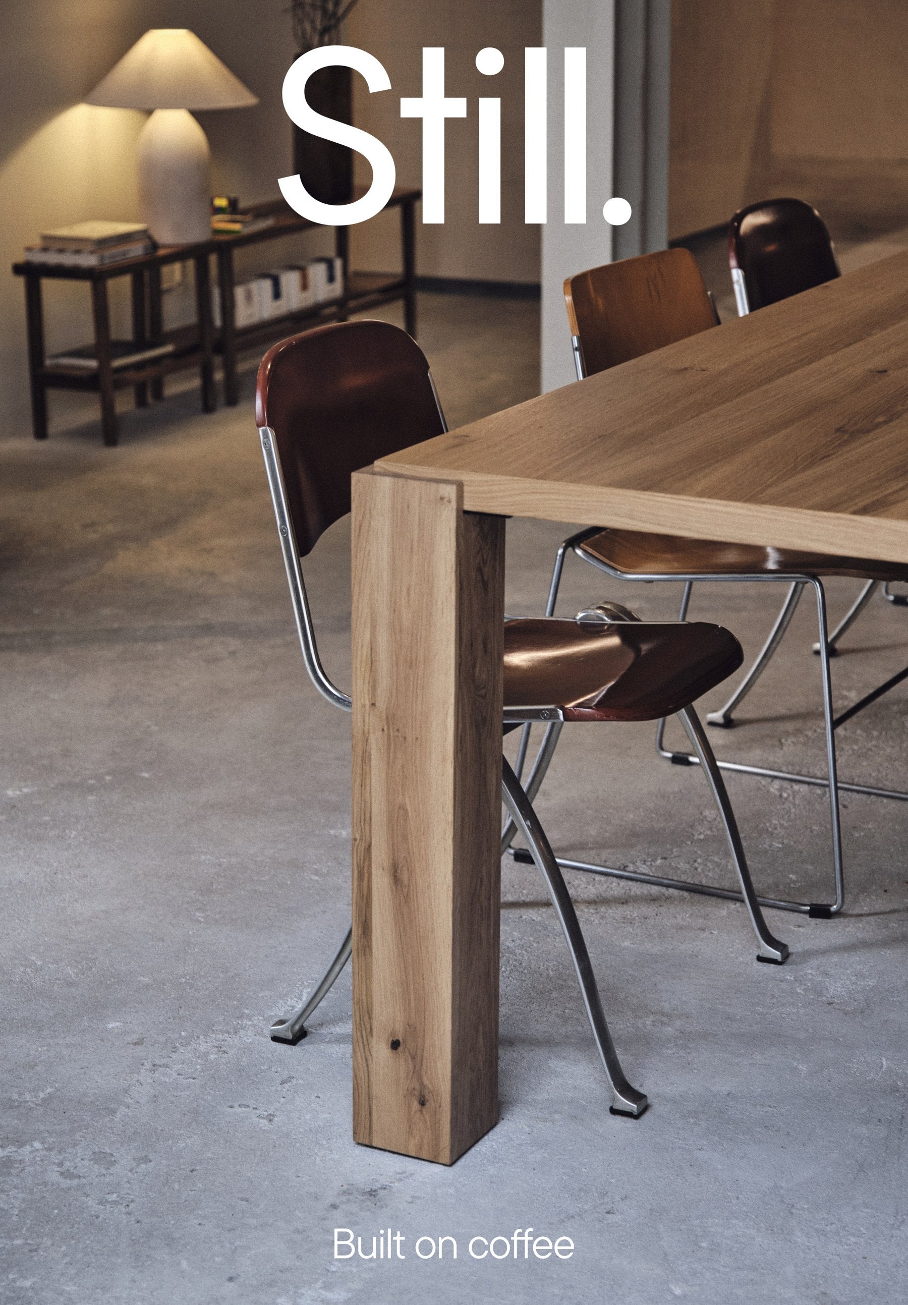 The cover of Still. Issue 00: a café table and chairs, with Still. and Built on coffee